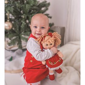 Bigjigs Toys Roza plašček z gumbi za punčko 28 cm